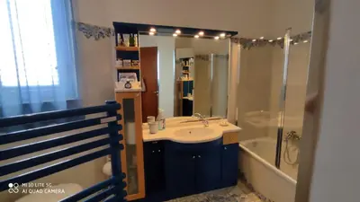 a bathroom with a sink and a shower at POLICLINICO HOME in Palermo