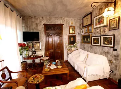 a living room with a white couch and a table at Accardi House Searooms in Palermo