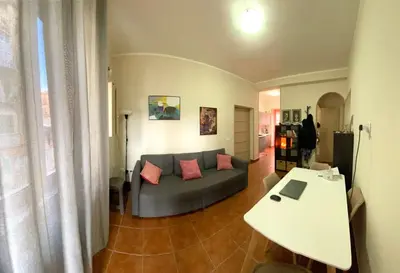 a living room with a couch and a table at Casa dello Spasimo in Palermo