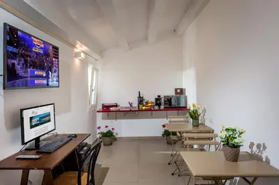an office with a desk with a computer on it at Affittacamere Nanà in Castellammare del Golfo