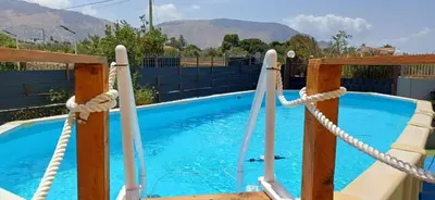 a swimming pool with a rope and a slide at Villa Torre Magaggiari in Cinisi