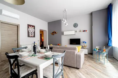 a living room with a table and a couch at Dream Home in Palermo
