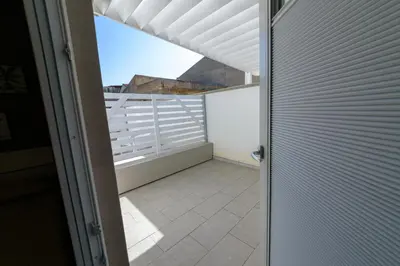an open door to a balcony with a view at Corleone GUESTHOUSE in Corleone