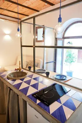 a kitchen with a sink and a counter top at Mediterranea - Piccola Dimora per Viaggiatori in Castellammare del Golfo
