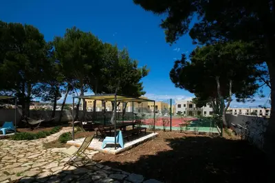 a park with a pavilion and a tennis court at Boa Vista San Vito - Area Fitness, Barbecue Area, Tennis Court in San Vito lo Capo