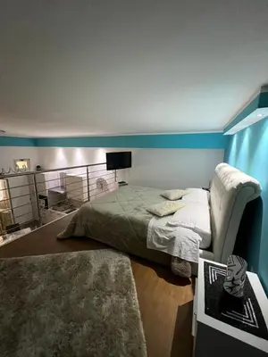 a bedroom with a bed and a television in it at Casa vacanza toledo in Partinico
