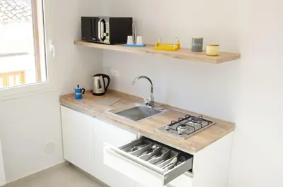 a kitchen with a sink and a counter top at Solemare Casa Vacanze in Castellammare del Golfo