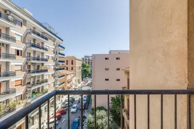a view of a city street from a balcony at GuestHost - Residenza dei Poeti - Roomy and Modern Flat in Palermo