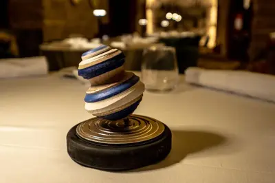 a stack of striped dishes sitting on a table at Hotel Borgo di Ciàula in Santa Flavia