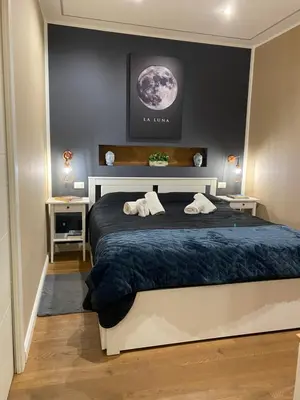 a bedroom with a bed with two towels on it at Apartament la Lumaca Kalsa in Palermo