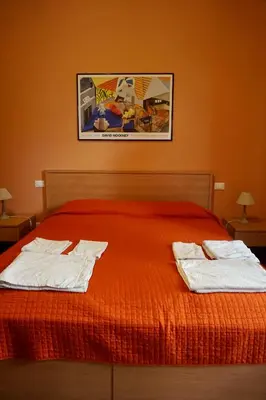 a bedroom with a bed with two towels on it at B&B Vivaldi in Palermo