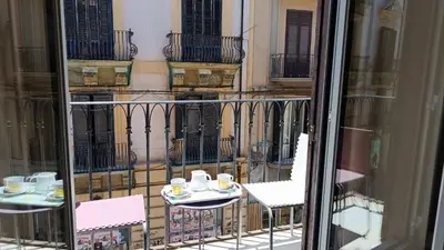 a view of a balcony with two tables and chairs at B&B Vivaldi in Palermo