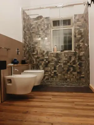 a bathroom with a tub and a toilet and a shower at Casavacanze Tuttapposto in Palermo