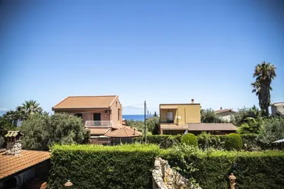 a view of a house from the garden at Dimora Fanale, Villa Esclusiva con Piscina Privata - Fanale Rentals in Altavilla Milicia