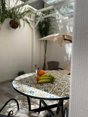 a table with a bunch of fruit on it at Tufoletto Apartment in Palermo