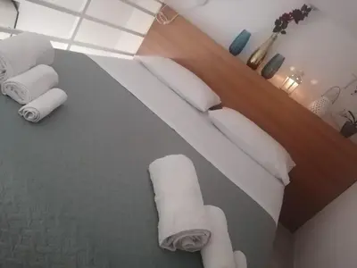 a room with a bed with rolled towels on it at Historic Centre - Apartment Near Teatro Massimo in Palermo