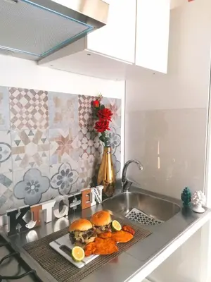 a kitchen counter with a plate of food on a sink at Historic Centre - Apartment Near Teatro Massimo in Palermo