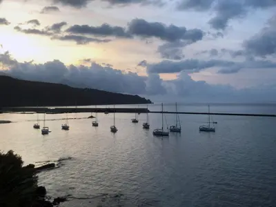 a group of boats sitting in a body of water at Le Camere della Campana in Castellammare del Golfo