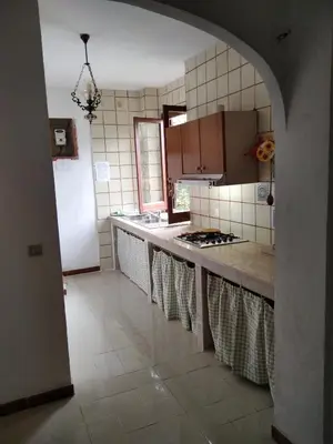 a kitchen with a sink and a counter top at casale guidaloca in Castellammare del Golfo