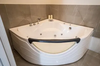 a bath tub with a face painted on it in a bathroom at Amaris in Palermo