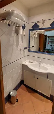 a bathroom with a sink and a mirror at Palermo Centrocittà in Palermo
