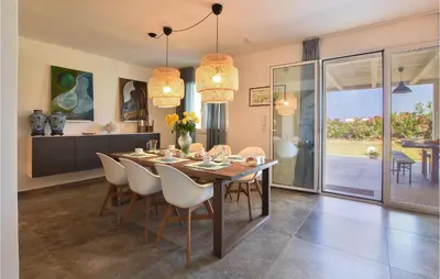 a dining room with a table and chairs at Gorgeous Home In Balestrate With Wifi in Balestrate