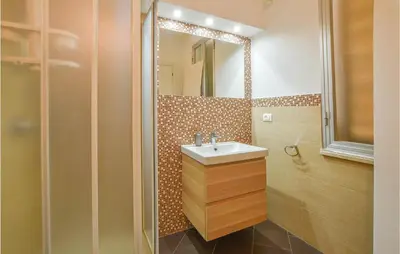 a bathroom with a sink and a mirror at Pet Friendly Home In Balestrate in Balestrate