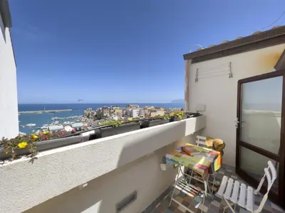 a balcony with a view of a city at Sicilia Ovest - Sea View Balcony Cerri in Castellammare del Golfo