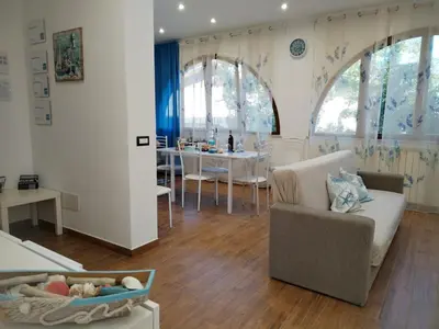 a living room with a couch and a table at Momaliar House in Campofelice di Roccella