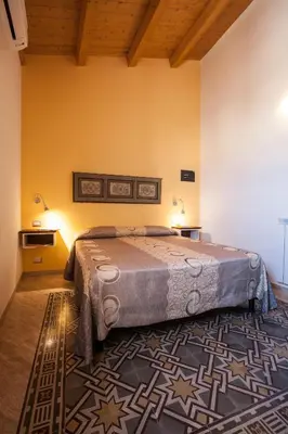 a bedroom with a large bed in a room at Sicilia Ovest - Sea View Terrace Dolce Vita in Castellammare del Golfo