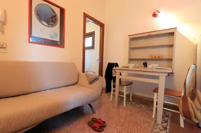 a living room with a couch and a table at Sicilia Ovest - Sea View Terrace Dolce Vita in Castellammare del Golfo