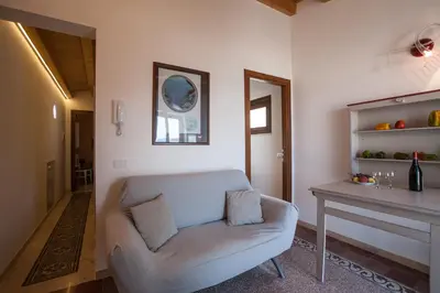 a living room with a couch and a table at Sicilia Ovest - Sea View Terrace Dolce Vita in Castellammare del Golfo