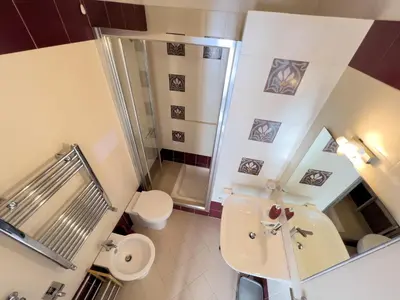 a small bathroom with a toilet and a sink at Sicilia Ovest - Balcone Bellavista in Castellammare del Golfo