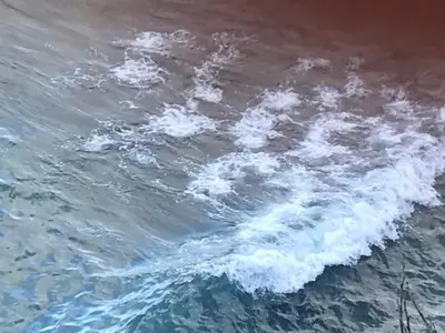 a body of water with a wave in it at By the Sea Apartment #4 in Terrasini
