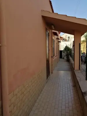 an alleyway between two buildings with at Villa Giardini in Balestrate