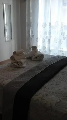 a bed with towels sitting on top of it at Casa Vacanza Da Sofì in Cerda