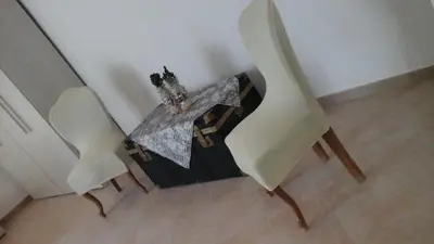 a table and two chairs in a room at Casa Vacanza Da Sofì in Cerda