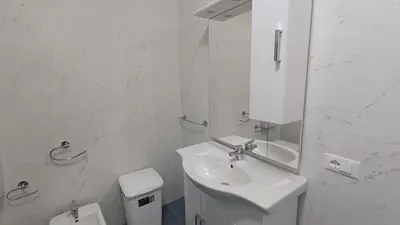 a white bathroom with a sink and a toilet at casa francesca 2 LOFTY in Castellammare del Golfo