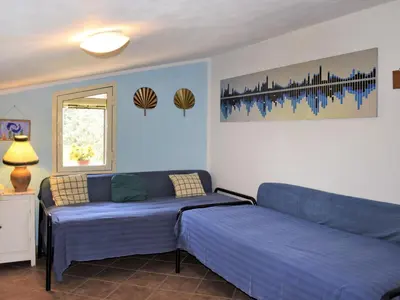 a living room with two beds and a couch at Villa Tenute Aversa by Interhome in Castellammare del Golfo