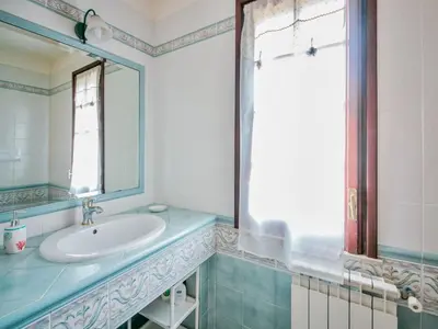 a bathroom with a sink and a mirror at Apartment Bouganville di Patrizia by Interhome in Castellammare del Golfo
