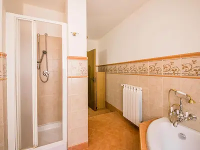 a bathroom with a tub and a shower and a sink at Apartment Bouganville di Patrizia by Interhome in Castellammare del Golfo