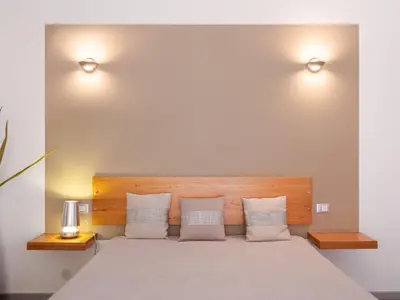 a bedroom with a large bed with two pillows at Villa Nicole con Dependance by Interhome in Castellammare del Golfo