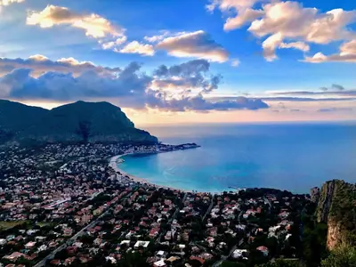 an aerial view of a city and the ocean at Quattro Canti al Cassaro in Palermo