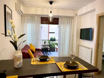 a dining room with a table with two glasses at Quattro Canti al Cassaro in Palermo