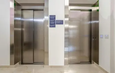 a row of elevator doors in a building at Cozy Apartment In Balestrate With Wifi in Balestrate
