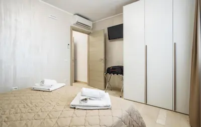 a bedroom with a bed with towels on it at Beautiful Apartment In Balestrate in Balestrate