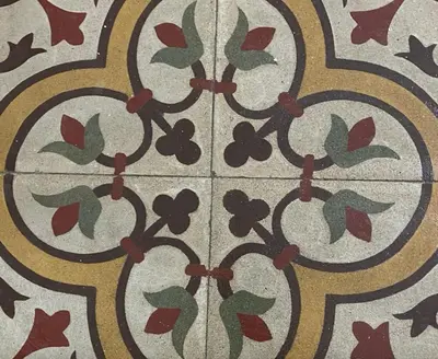a tile floor with a floral pattern on it at Patio1861 - A Sicilian deluxe apartment in Termini Imerese