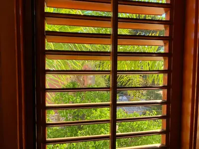 a window with a view of a tree at TORRE MARIZA Guidaloca in Scopello