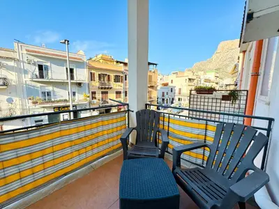 two benches sitting on a balcony with a view at Le Maioliche in Sferracavallo