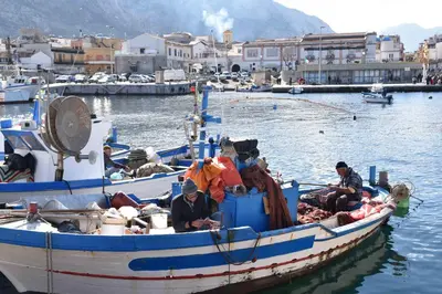 a group of people on a boat in the water at Isola bella in Isola delle Femmine